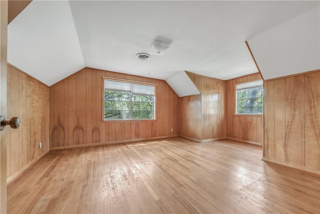 1500 Galde St, College Station, TX 77840 - bonus room featuring hardwood / wood-style floors, plenty of natural light, wood walls, and vaulted ceiling
