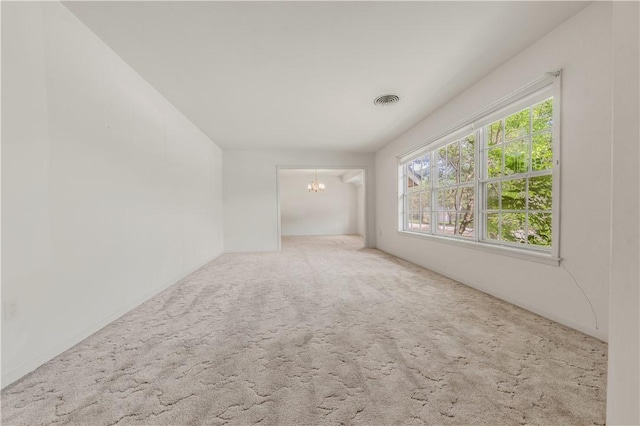 1500 Galde St, College Station, TX 77840 - spare room with a chandelier and carpet floors