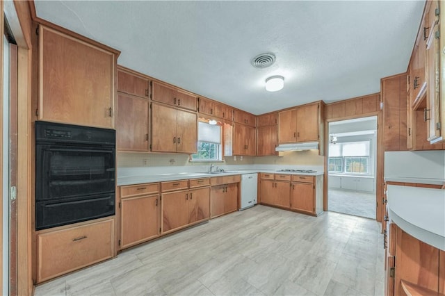 1500 Galde St, College Station, TX 77840 - kitchen featuring light countertops, white appliances, a warming drawer, and plenty of natural light