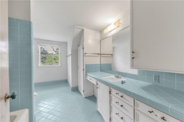 1500 Galde St, College Station, TX 77840 - full bathroom featuring vanity, tile patterned flooring, and decorative backsplash