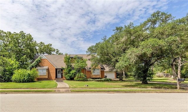 1500 Galde St, College Station, TX 77840 - view of front of home featuring a front lawn and a garage