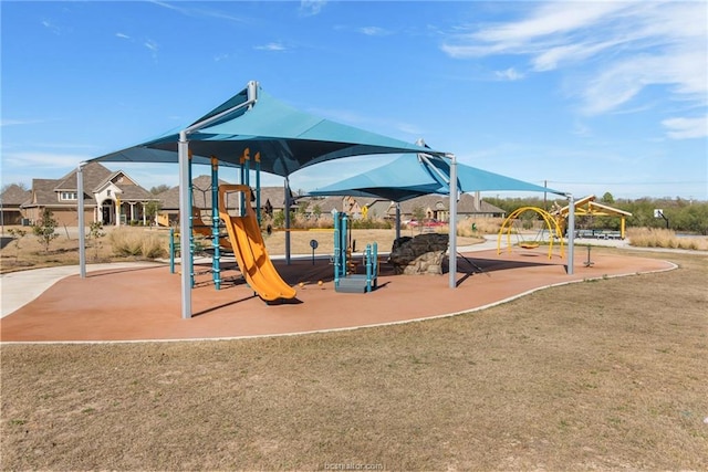 community play area featuring a lawn