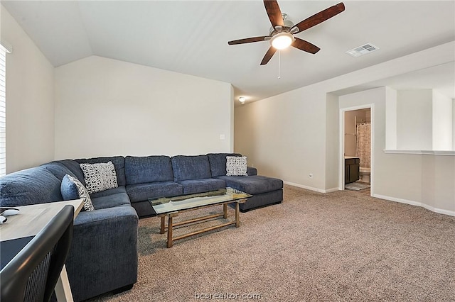 carpeted living room featuring vaulted ceiling and ceiling fan