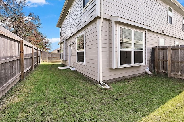 view of property exterior featuring a lawn