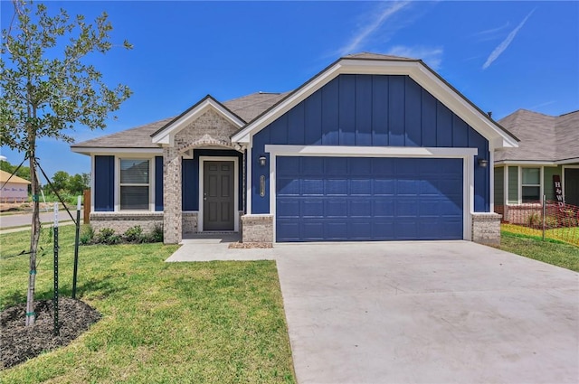 craftsman inspired home with a garage and a front lawn