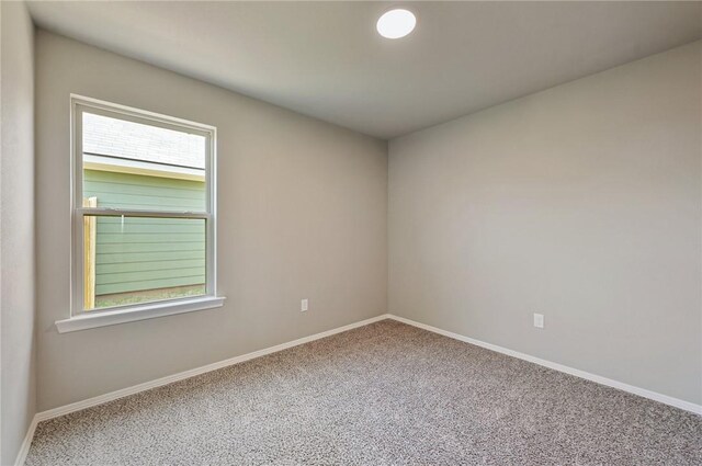 empty room featuring carpet floors