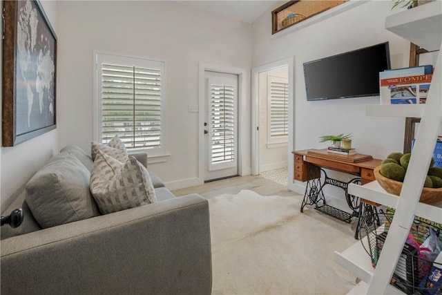 living room featuring baseboards