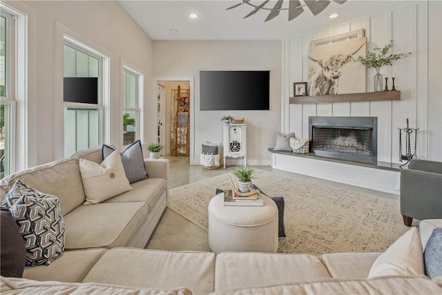 living area featuring a fireplace and recessed lighting