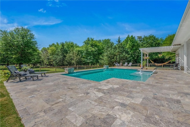 outdoor pool with a patio area
