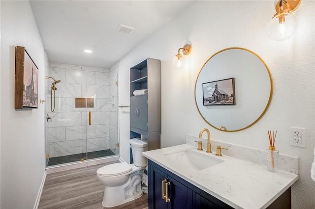 6191 Bethel Cemetery Rd, North Zulch, TX 77872 - full bathroom with toilet, wood finished floors, vanity, a stall shower, and baseboards