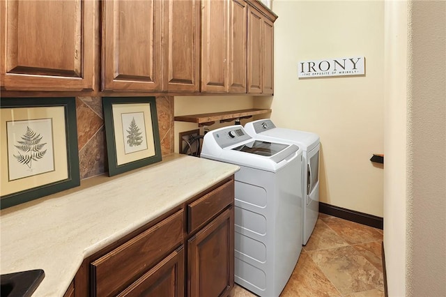 laundry area with cabinets and washer and dryer