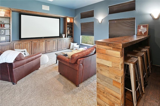 cinema room with light wood-type flooring