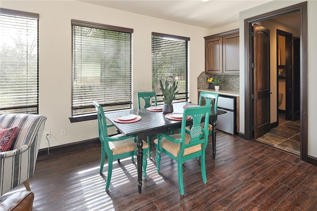 dining space featuring dark hardwood / wood-style floors