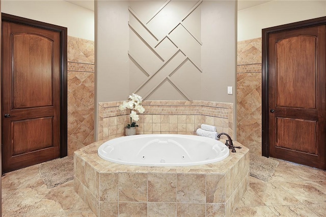 bathroom featuring a relaxing tiled tub