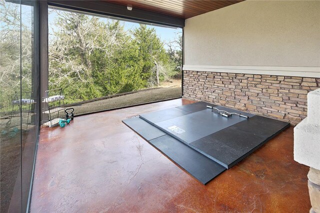 view of patio with ceiling fan and an outdoor living space with a fireplace