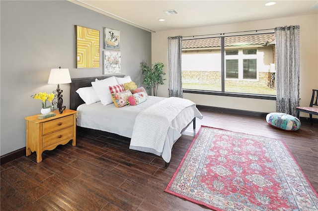 bedroom featuring dark hardwood / wood-style flooring