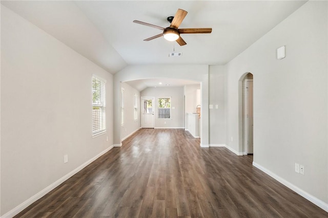 unfurnished living room with ceiling fan, dark hardwood / wood-style flooring, and lofted ceiling