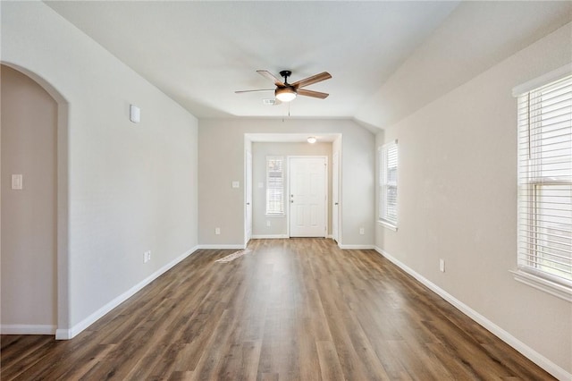 interior space featuring ceiling fan and dark wood-type flooring