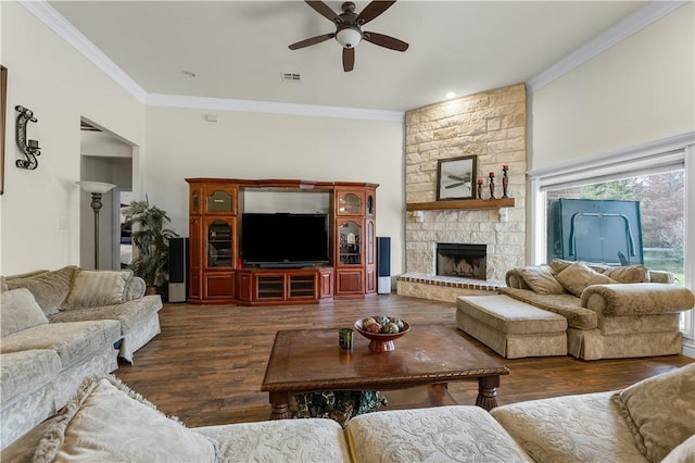 living room featuring visible vents, ceiling fan, ornamental molding, dark wood-style flooring, and a fireplace