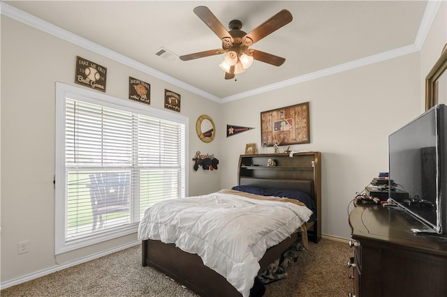 carpeted bedroom featuring a ceiling fan, baseboards, and crown molding