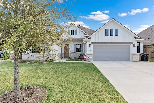 view of front of property featuring a garage and a front lawn