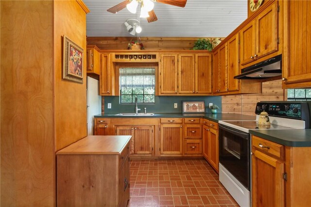 kitchen with decorative backsplash, white appliances, ceiling fan, and sink