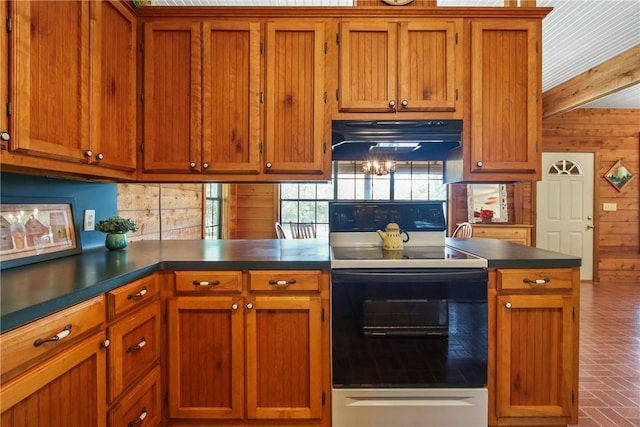 kitchen with backsplash, kitchen peninsula, wood walls, and white electric range oven