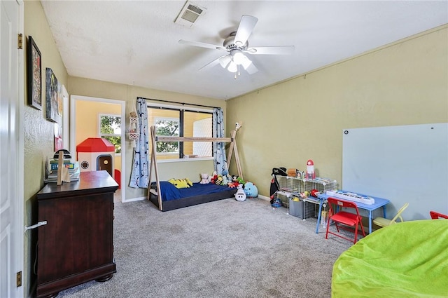 carpeted bedroom with ceiling fan