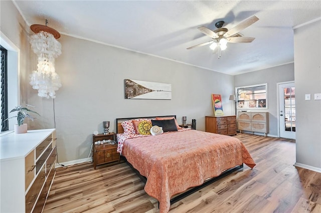 bedroom with ceiling fan and light wood-type flooring