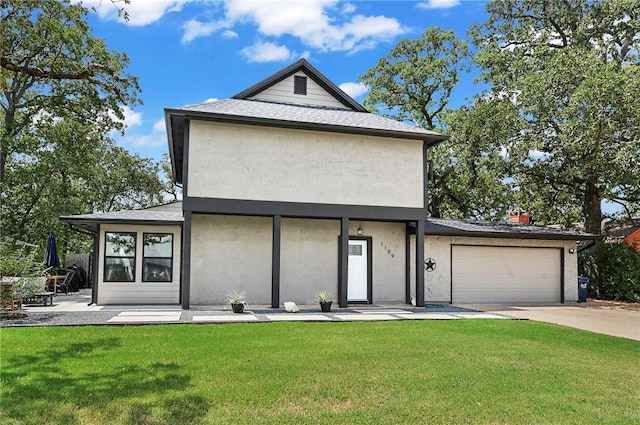 view of front of home with a garage and a front yard