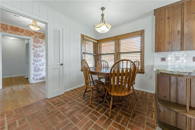 107 E N Ave, Bryan, TX 77801 - dining space with brick floors and baseboards