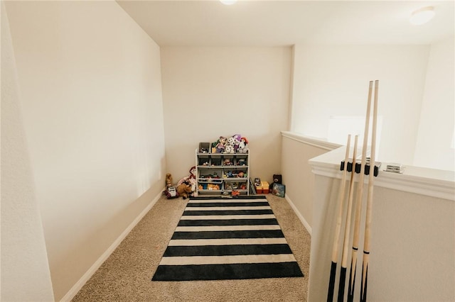 interior space with baseboards and carpet floors