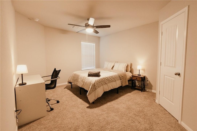 bedroom featuring baseboards, carpet floors, visible vents, and ceiling fan