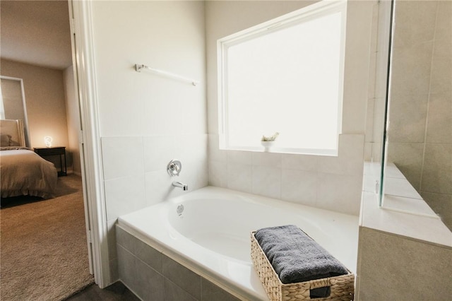 full bath featuring a garden tub and ensuite bathroom