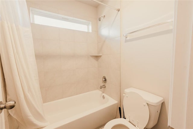 bathroom with toilet and shower / tub combo with curtain