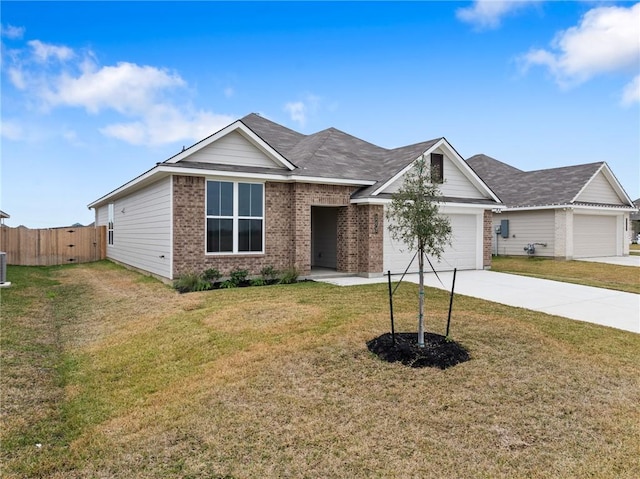 view of front of home featuring a front yard and a garage