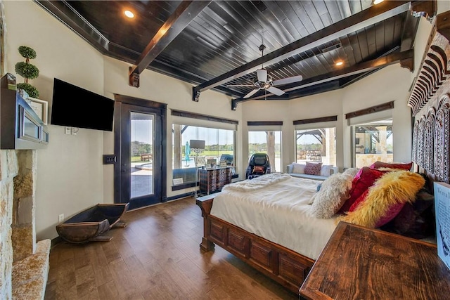 2289 Old Dobbin Rd, Montgomery, TX 77316 - bedroom featuring access to exterior, wood finished floors, and a wooden ceiling with exposed beams