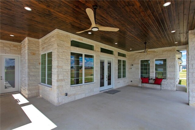 view of patio / terrace featuring ceiling fan and french doors