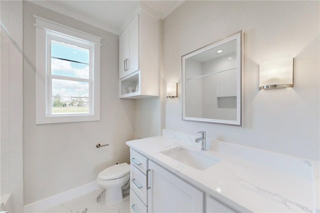 bathroom featuring vanity, toilet, and a shower