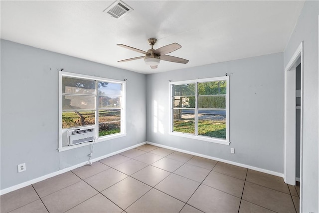 tiled empty room with cooling unit and ceiling fan