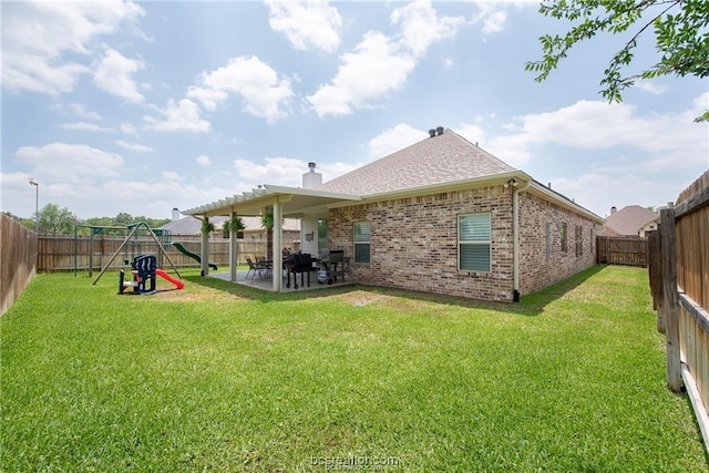 3549 Foxcroft Path, Bryan, TX 77808 - rear view of property with a patio area, brick siding, a playground, a chimney, and a fenced backyard