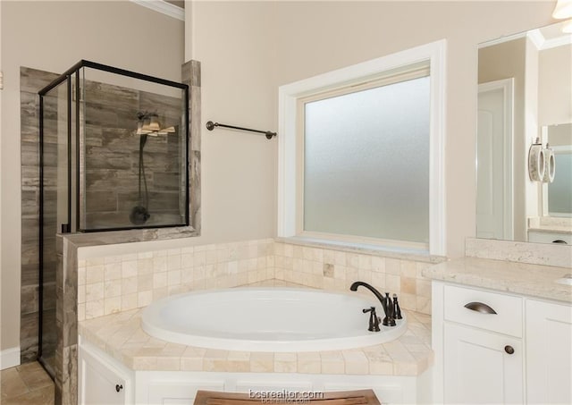 3549 Foxcroft Path, Bryan, TX 77808 - full bathroom with a bath, vanity, a stall shower, and crown molding
