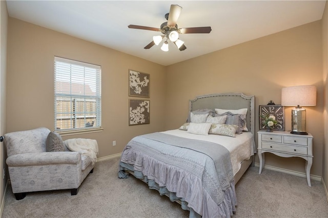 bedroom featuring ceiling fan and light colored carpet