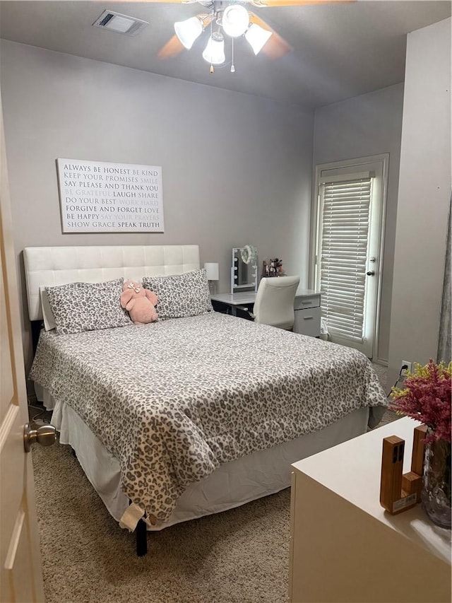 152 Forest Dr, College Station, TX 77840 - carpeted bedroom with a ceiling fan
