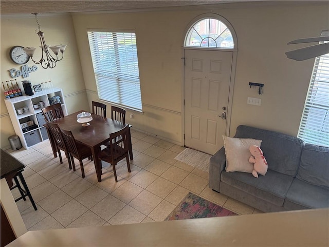 152 Forest Dr, College Station, TX 77840 - dining space with a chandelier, ornamental molding, and light tile patterned flooring