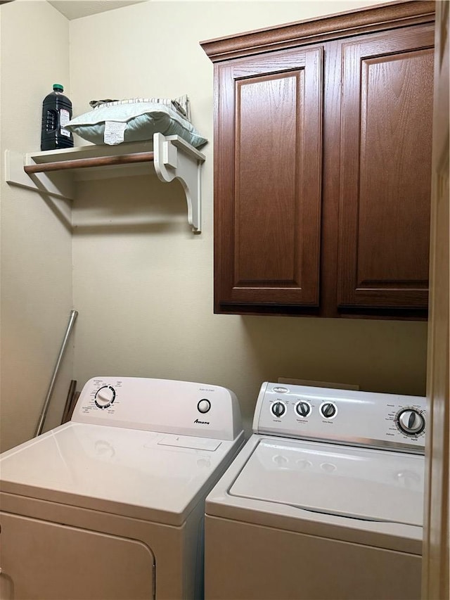 152 Forest Dr, College Station, TX 77840 - laundry area featuring washing machine and dryer and cabinet space
