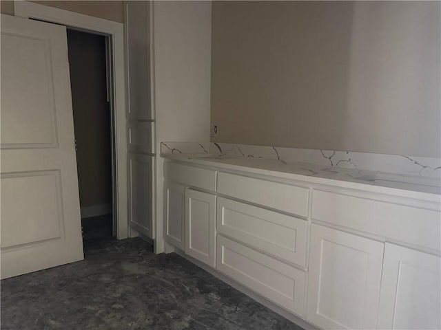807 S Coulter Dr, Bryan, TX 77803 - bathroom featuring unfinished concrete flooring and dual sinks