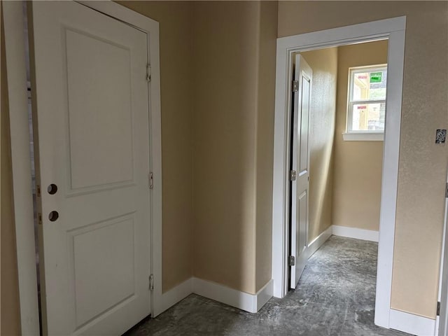 807 S Coulter Dr, Bryan, TX 77803 - hallway with baseboards and concrete flooring