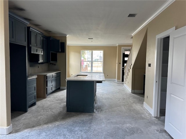 807 S Coulter Dr, Bryan, TX 77803 - kitchen with ornamental molding, concrete flooring, exhaust hood, a center island, and light countertops