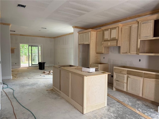 807 S Coulter Dr, Bryan, TX 77803 - kitchen with light brown cabinetry and a center island